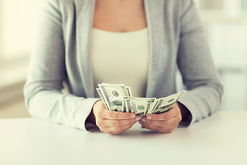 Image showing close up of woman hands counting us dollar money