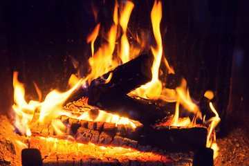 Image showing close up of firewood burning in fireplace