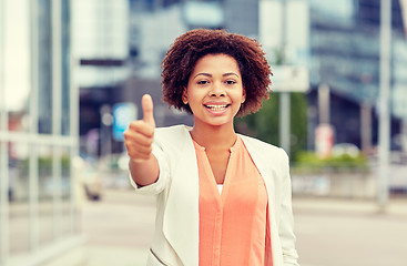 Image showing happy young african american businesswoman in city