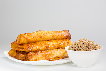 Image showing pancakes with meat on white plate