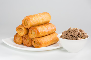 Image showing pancakes with meat on white plate