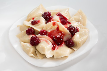 Image showing Homemade traditional Ukrainian dumplings, vareniki with cherries