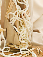 Image showing Clothespins, Cord And Vase