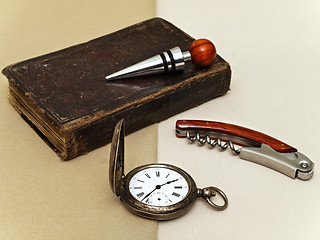 Image showing Clock, Book, Corkscrew And Stopper