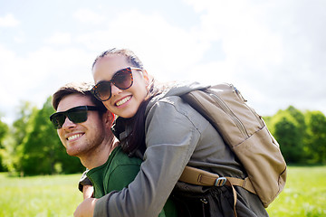 Image showing happy couple with backpacks having fun outdoors