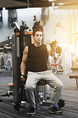 Image showing man exercising on gym machine