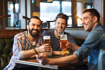 Image showing friends taking selfie and drinking beer at bar