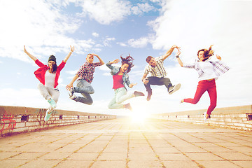 Image showing group of teenagers jumping