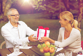 Image showing happy family having holiday dinner outdoors