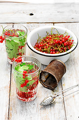 Image showing Tea with berries and leaves of currant