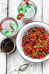 Image showing Tea with berries and leaves of currant