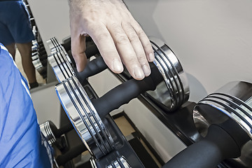 Image showing grabbing a dumbbell