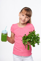 Image showing Girl holding jar tumbler mug with green smoothie drink