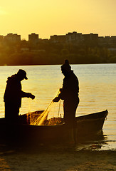 Image showing Fishermen silhouette at sunset