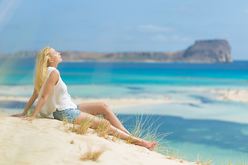 Image showing Relaxed Happy Woman Enjoying Sun on Vacations.