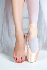Image showing The close-up feet of young ballerina in pointe shoes