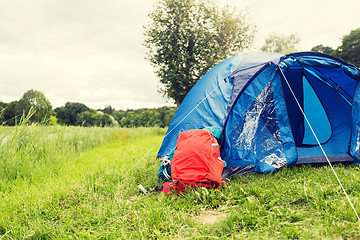 Image showing touristic tent and backpack outdoors