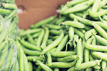 Image showing close up of green peas in box at street market