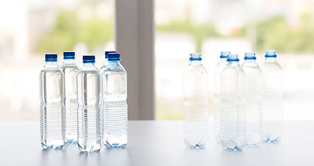 Image showing close up of bottles with drinking water on table