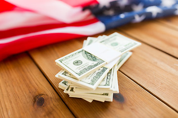 Image showing close up of american flag and dollar cash money