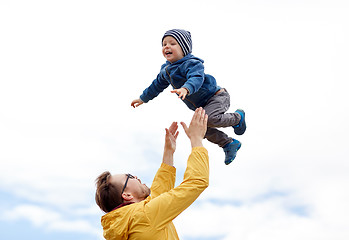 Image showing father with son playing and having fun outdoors