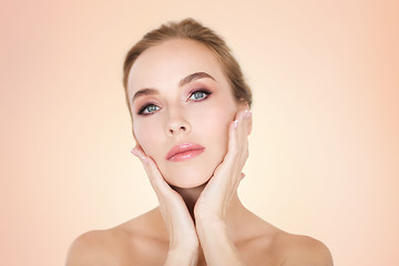 Image showing beautiful young woman face and hands