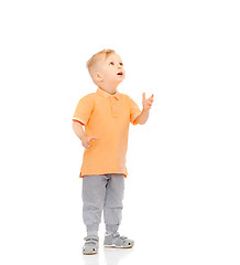 Image showing happy little boy looking up