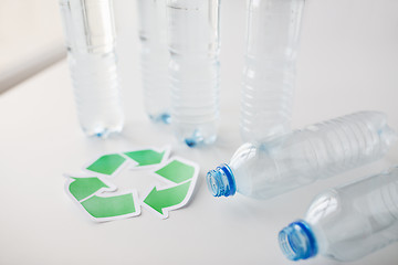 Image showing close up of plastic bottles and recycling symbol