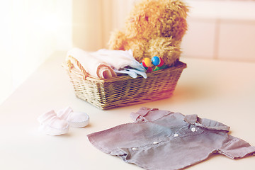 Image showing close up of baby clothes and toys for newborn