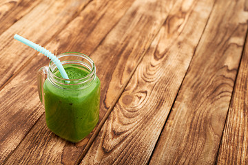 Image showing Jar tumbler mug with green smoothie drink