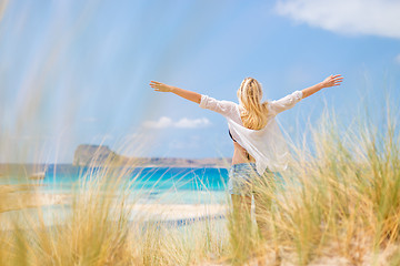 Image showing Free Happy Woman Enjoying Sun on Vacations.