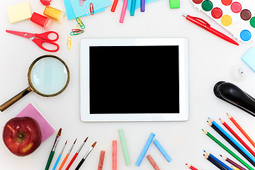 Image showing School set with notebooks, pencils, brush, scissors and apple on white background