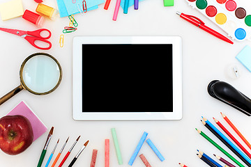 Image showing School set with notebooks, pencils, brush, scissors and apple on white background