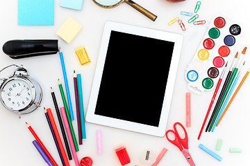 Image showing School set with notebooks, pencils, brush, scissors and apple on white background