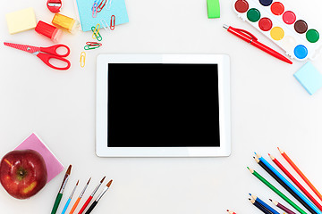 Image showing School set with notebooks, pencils, brush, scissors and apple on white background