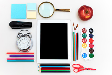 Image showing School set with notebooks, pencils, brush, scissors and apple on white background