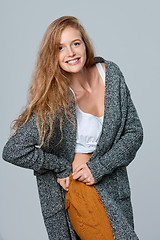 Image showing Laughing woman in warm knitted cardigan