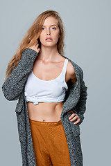 Image showing Fashionable beautiful woman in warm knitted cardigan