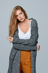 Image showing Fashionable beautiful woman in warm knitted cardigan