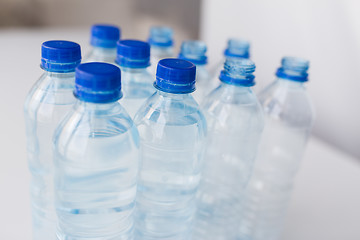 Image showing close up of bottles with drinking water on table