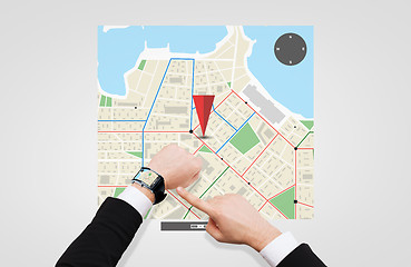 Image showing businessman pointing to smart watch at his hand