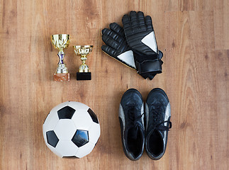 Image showing soccer ball, boots, goalkeeper gloves and cups