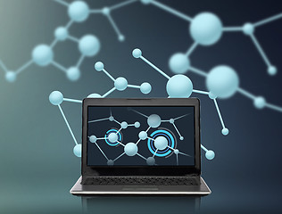 Image showing laptop computer with molecules structure on screen