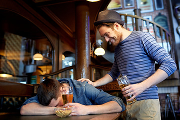 Image showing male friends drinking beer at bar or pub