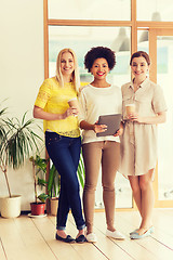 Image showing creative team with tablet pc and coffee in office