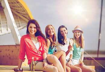 Image showing girls with drinks on the beach