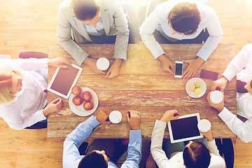 Image showing close up of business team drinking coffee on lunch