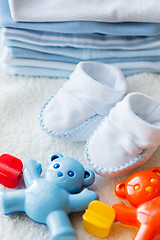 Image showing close up of baby rattle and bootees for newborn