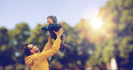 Image showing father with son playing and having fun outdoors