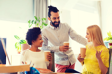 Image showing business team with coffee cups talking at office